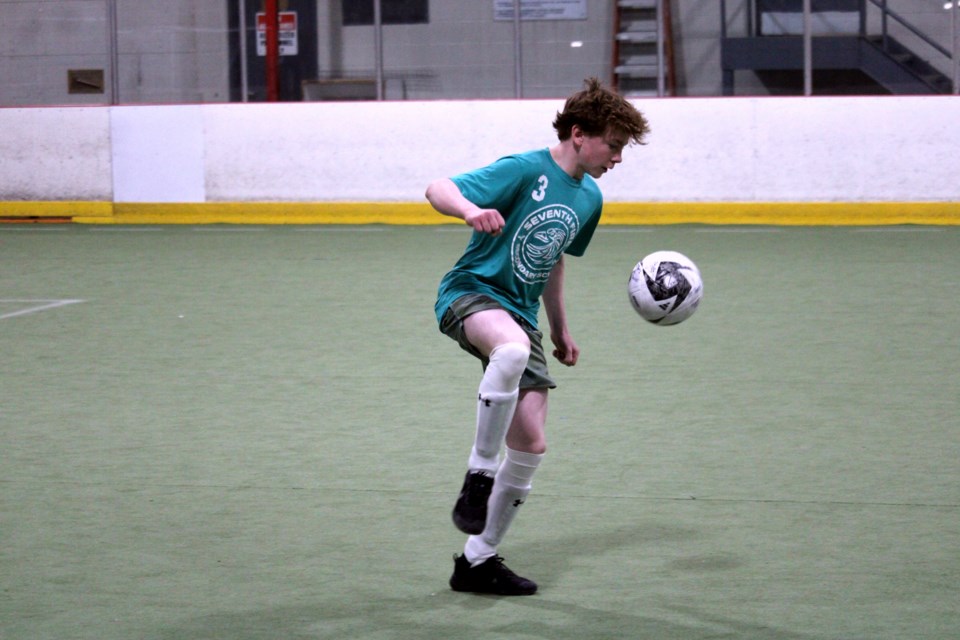 seventh-fire-boy-playing-soccer