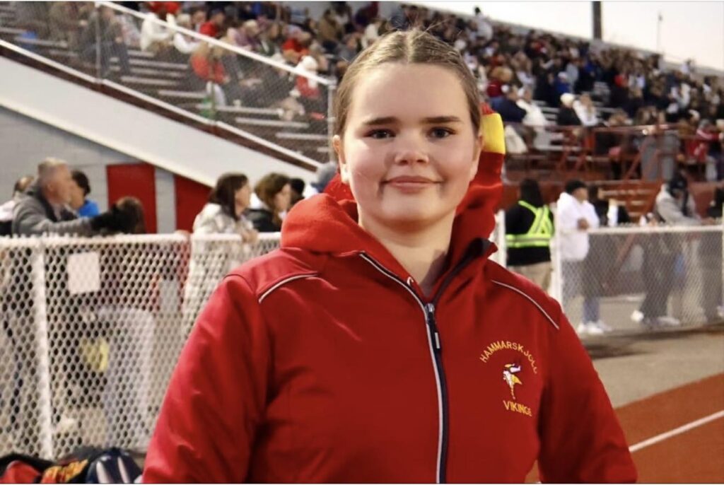 hammarskjold-cheerleading-teammate-on-field