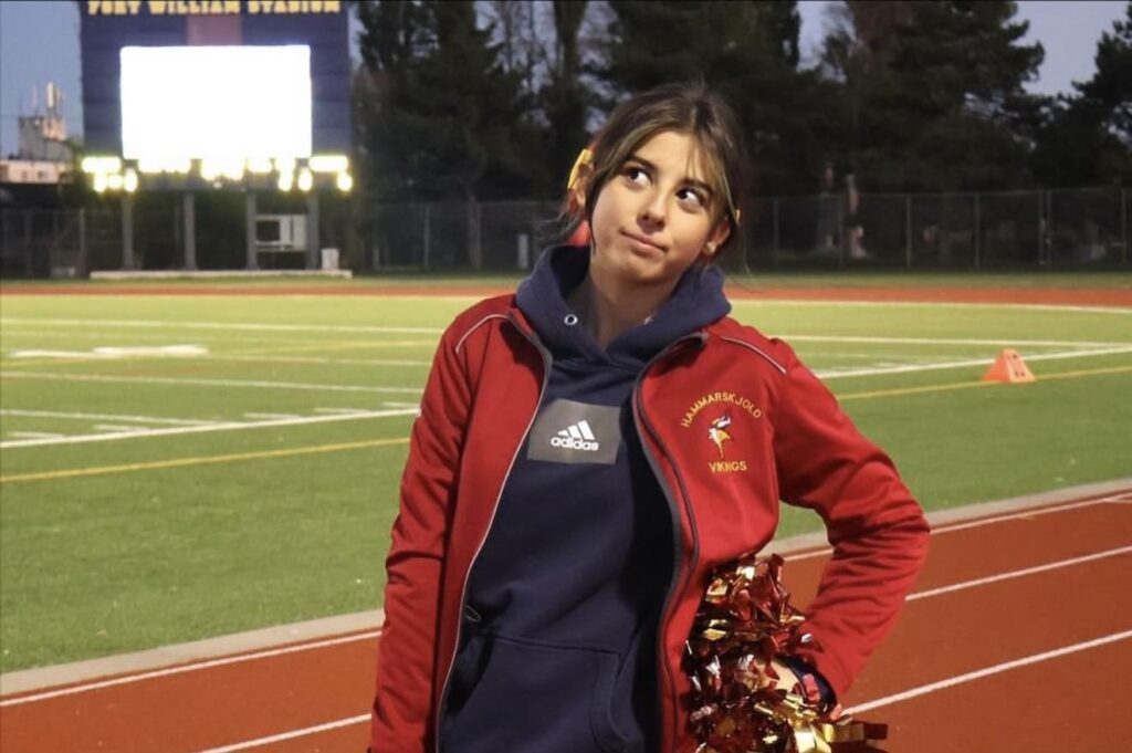 hammarskjold-cheerleading-teammate-on-field