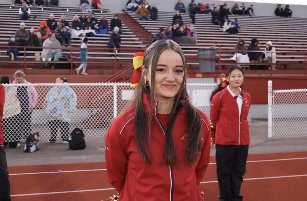 hammarskjold-cheerleading-teammate-on-field