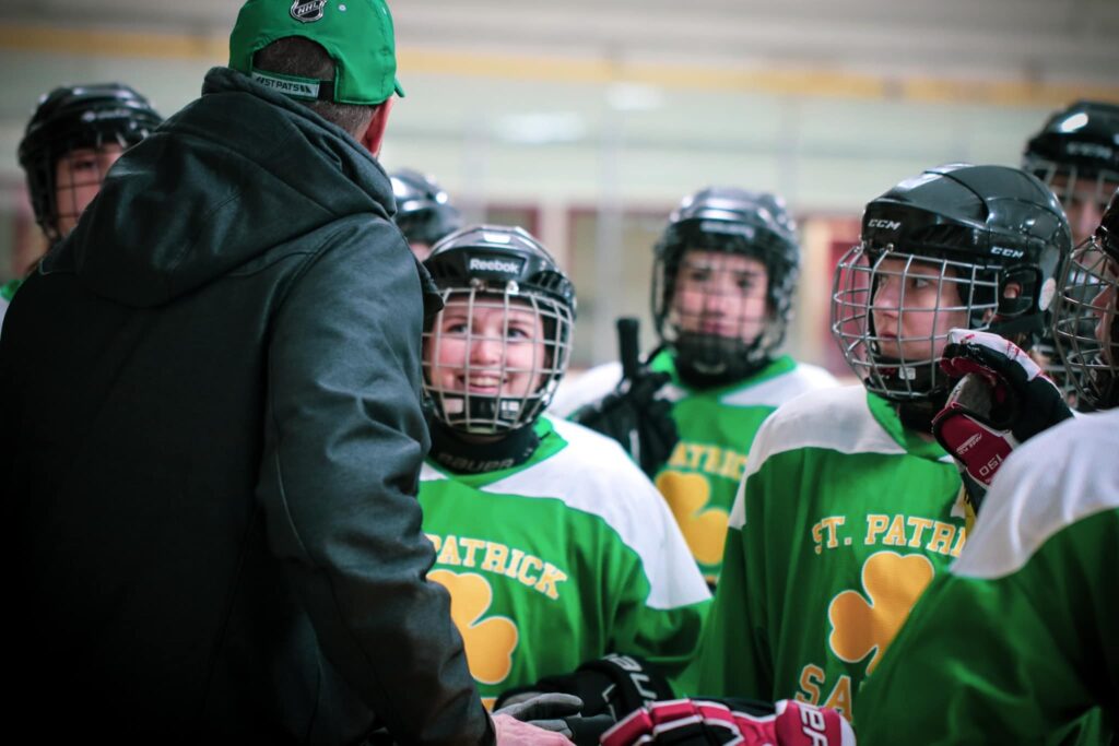 st-patrick-girls-hockey-team-talking-to-coach