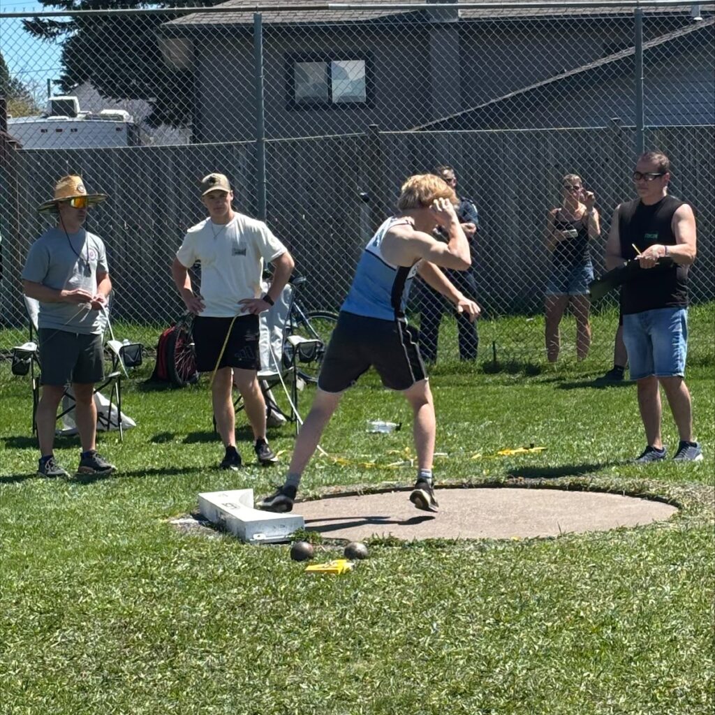 superior-track-&-field-boy-throwing