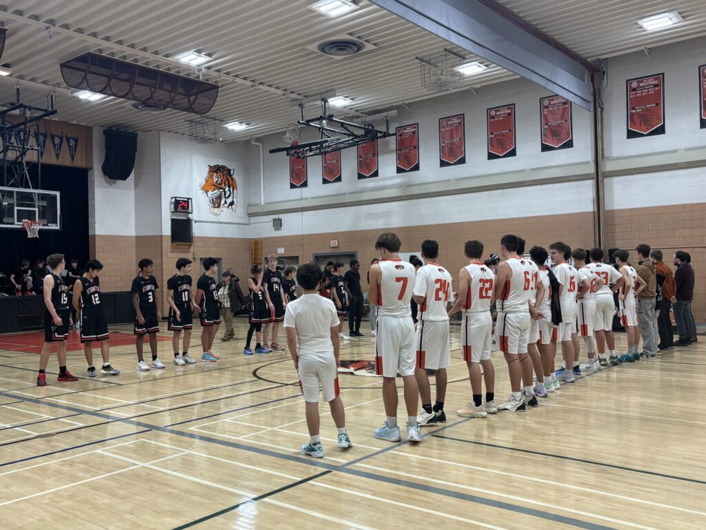 westgate-basketball-boys-team-standing-in-front-of-st-ignatius-basketball-boys-team