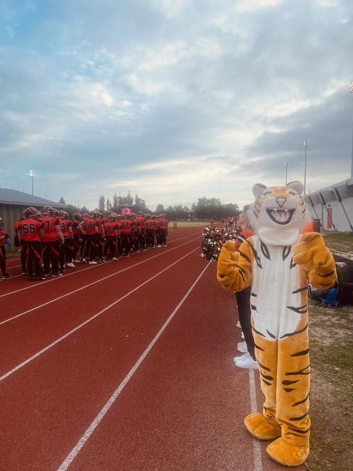 westgate-cvi-football-team-lined-up-mascot