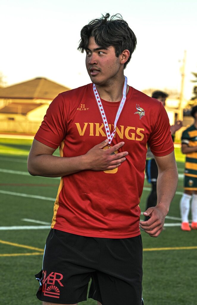 hammarskjold-boys-soccer-team-receiving-metal