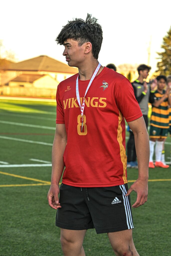 hammarskjold-boys-soccer-team-receiving-metal