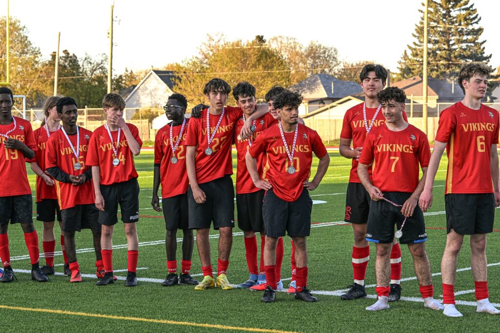 hammarskjold-boys-soccer-team-receiving-metal
