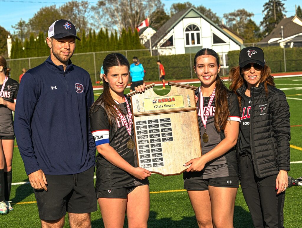 st-ignatius-two-girls-soccer-with-plaque