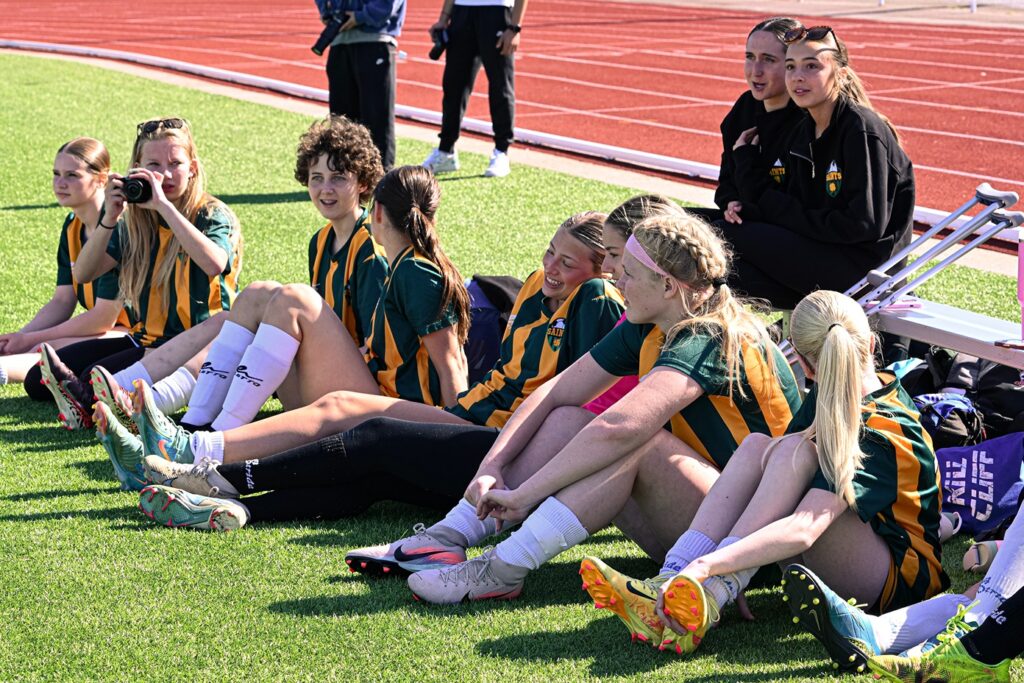 st-patrick-girls-soccer-team-sitting-watching