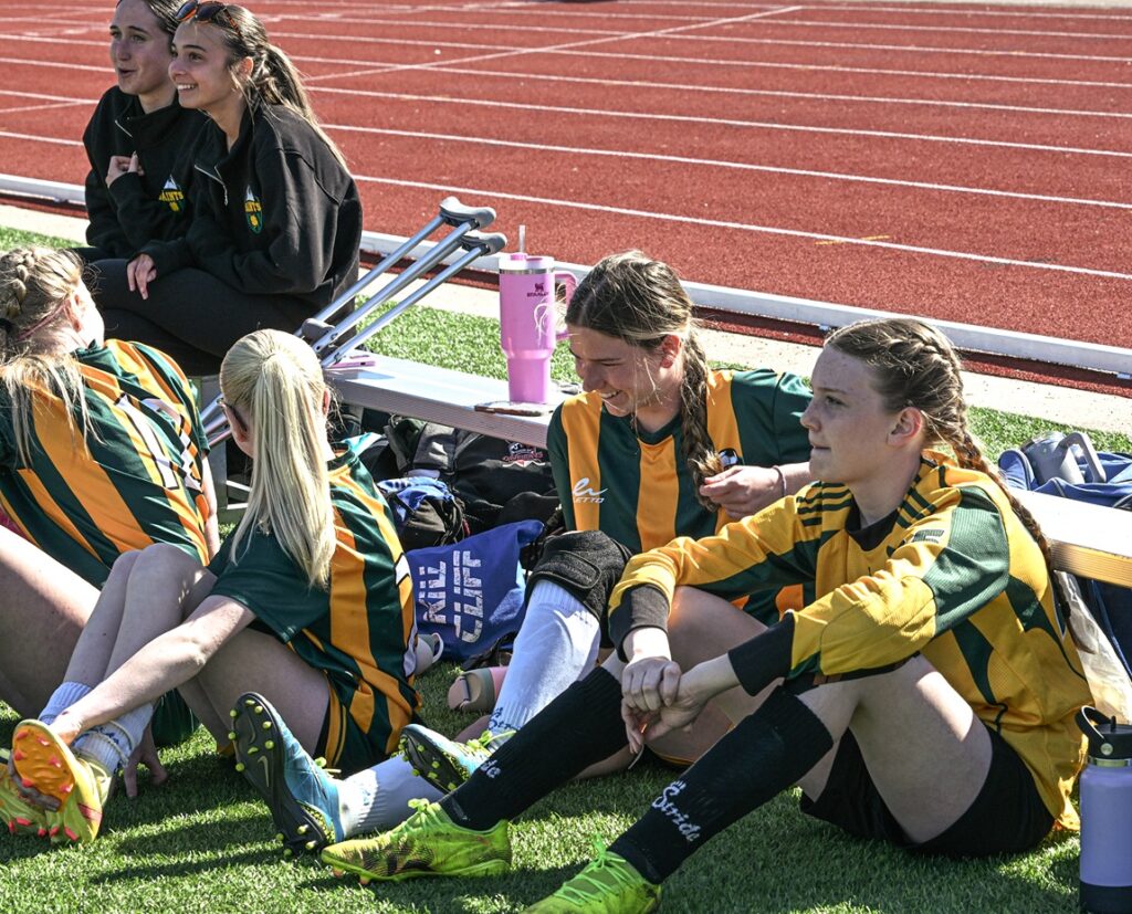 st-patrick-girls-soccer-team-sitting-watching