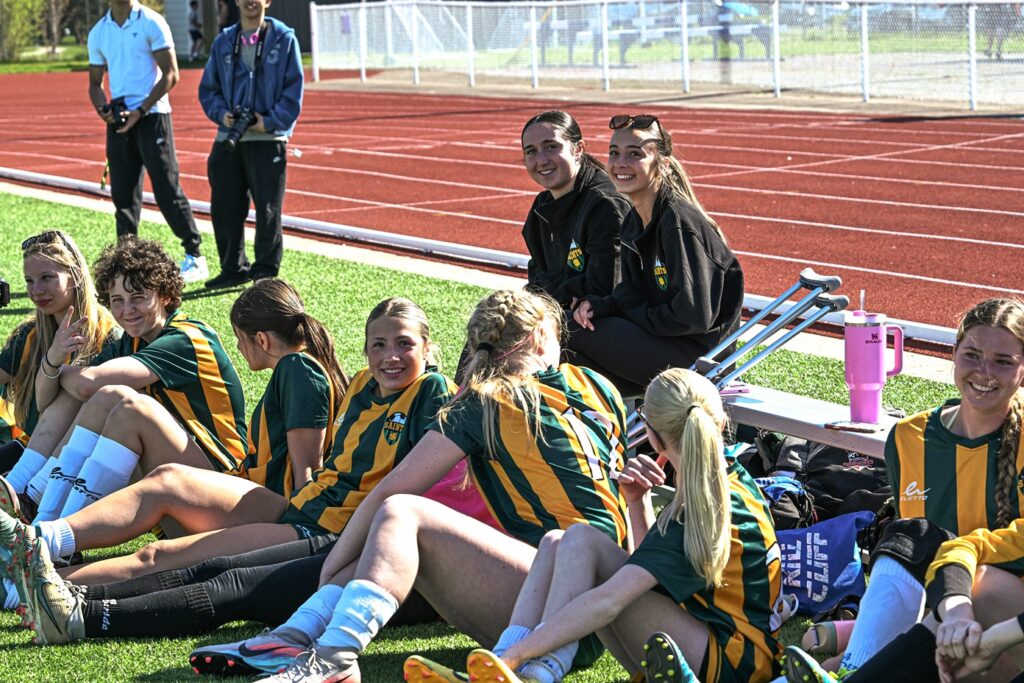st-patrick-girls-soccer-team-sitting-watching